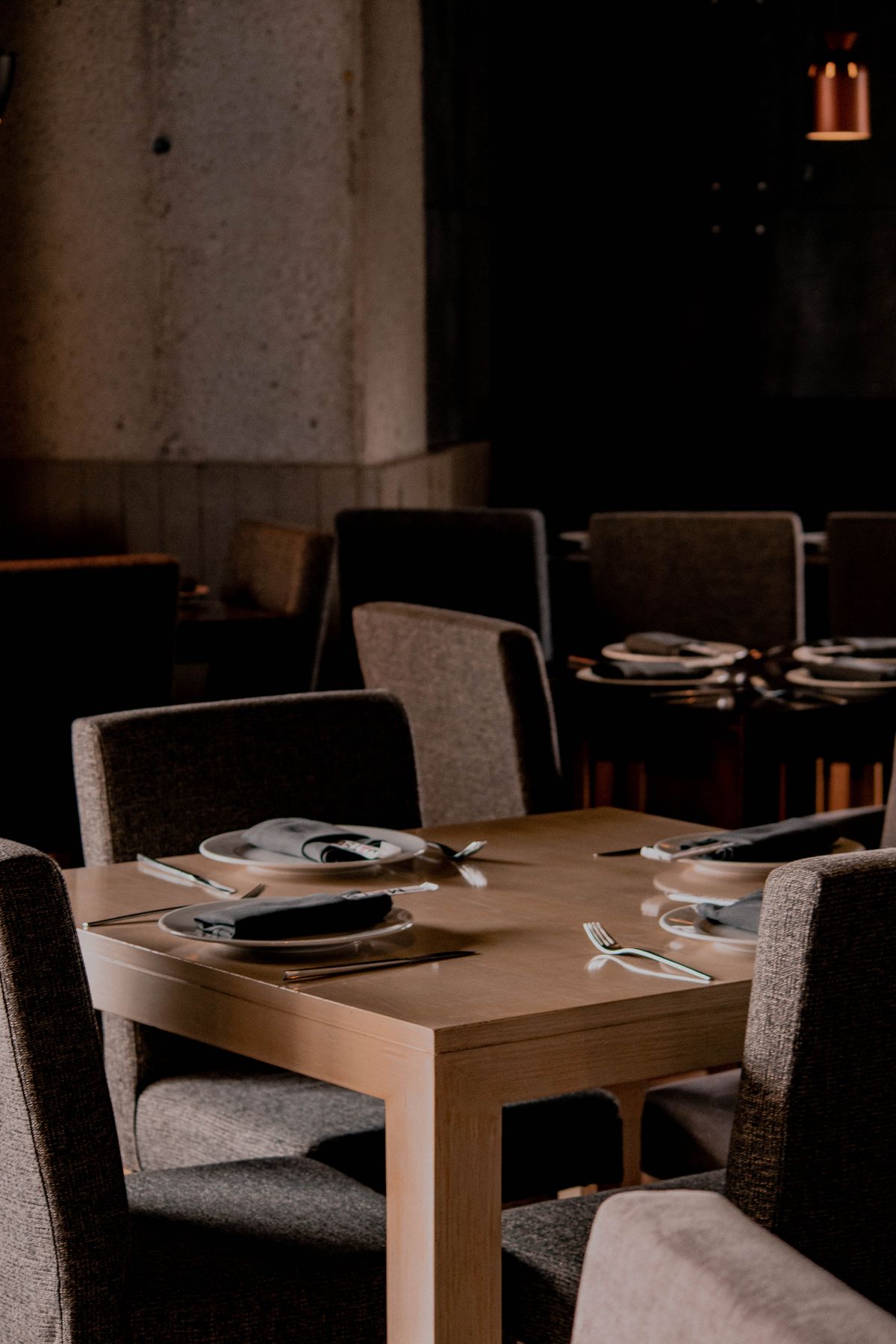 Guests enjoying a meal at a candlelit table