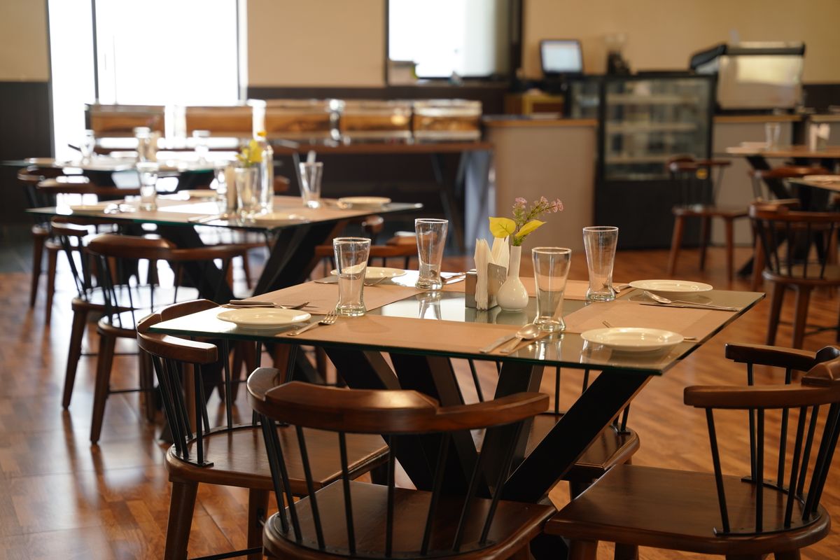 Modern restaurant dining area with large windows