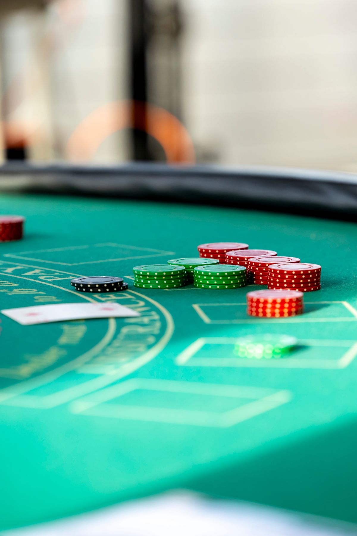Casino gaming floor with players at tables